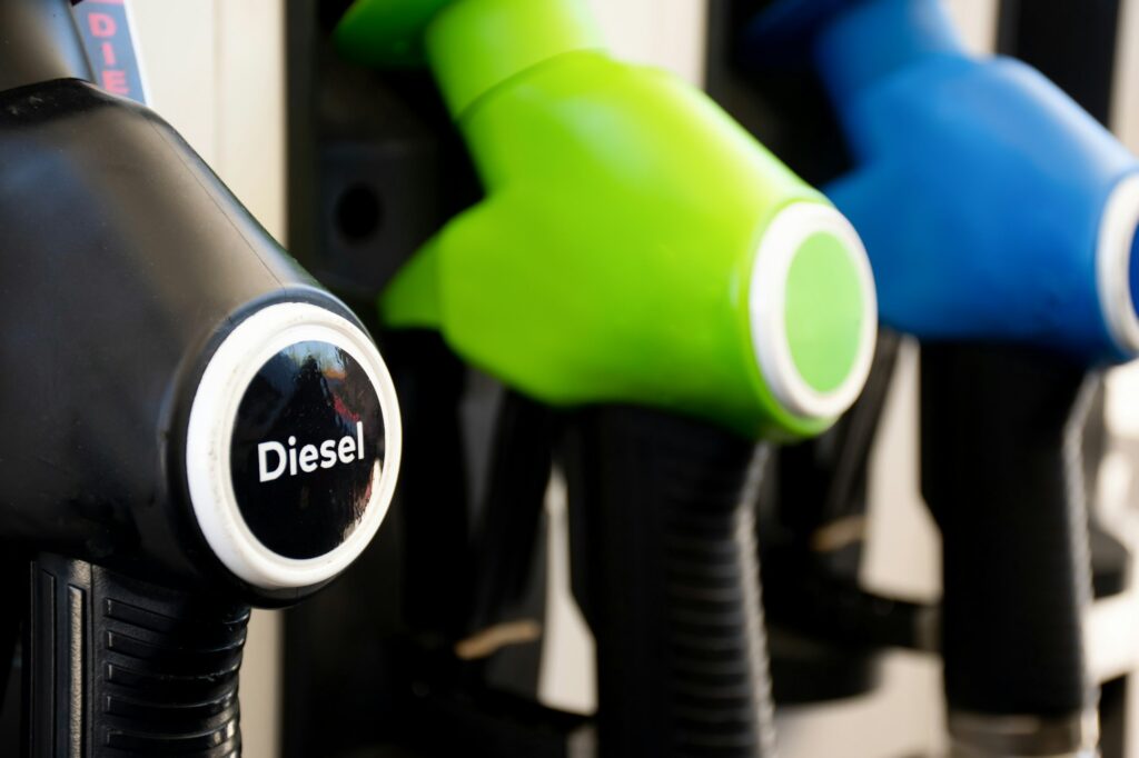 Diesel and petrol pumps on a gas station. Fuel nozzles oil dispensers.